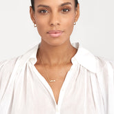 14k Yellow Gold Puff Love Pendant Necklace on woman's neck